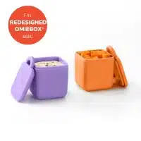 Set de dos recipientes OmieDip de silicona morado y anaranjado para cremas y snacks en la lonchera OmieBox